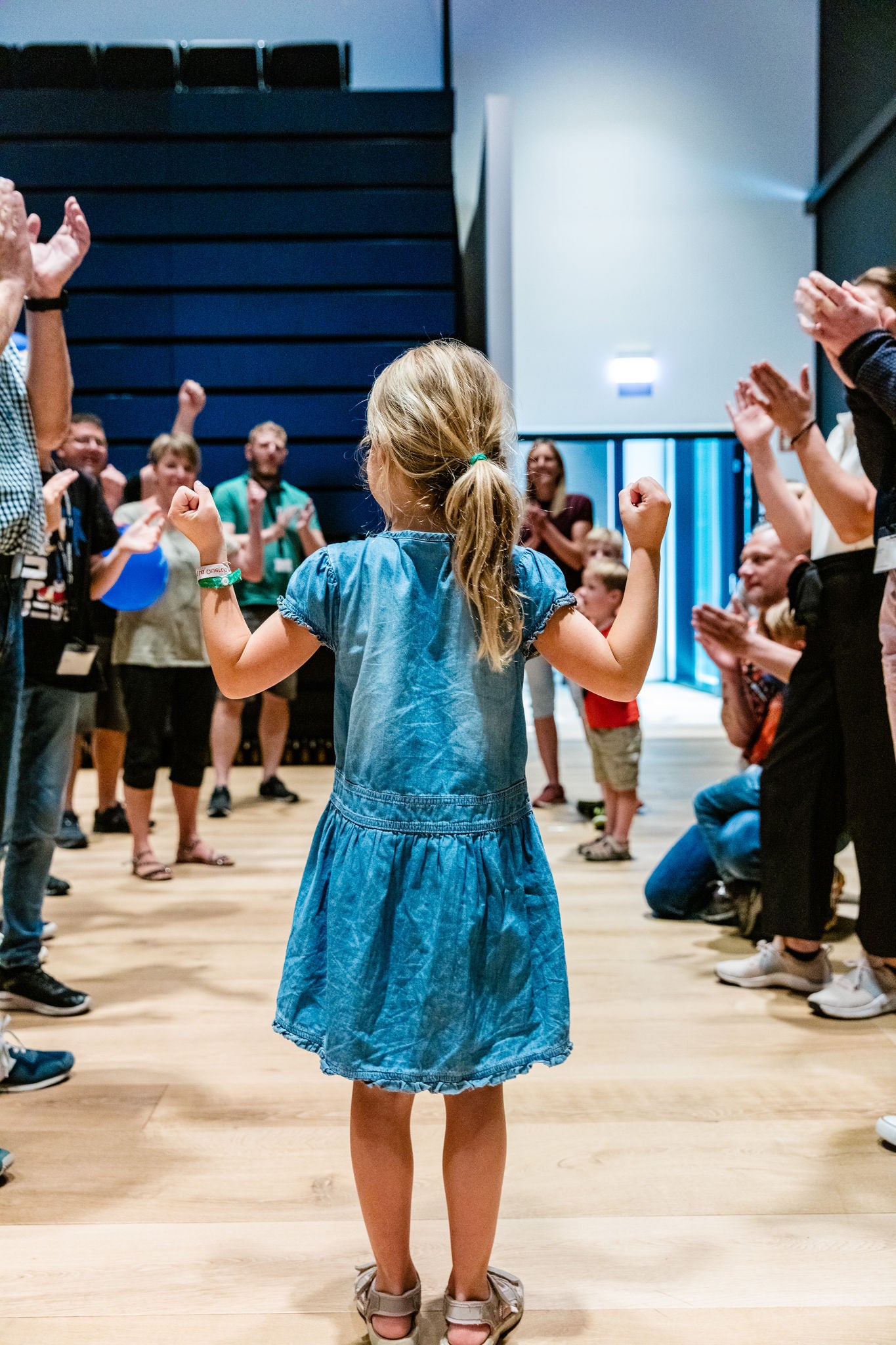 Child Celebrating in Community Gathering
