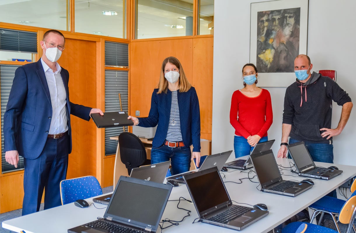 Office Meeting with Laptops and MULTIVAC Presentation