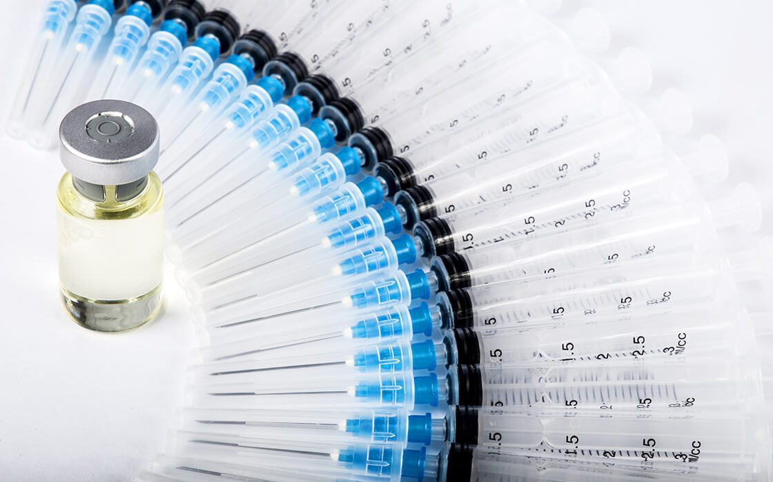 Syringes and Vaccine Vial Medical Supplies Image