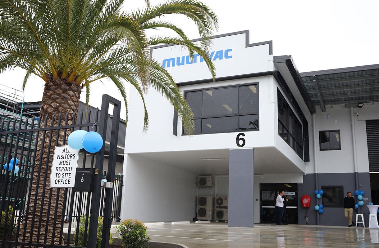 MULTIVAC Facility Exterior with Palm Tree View