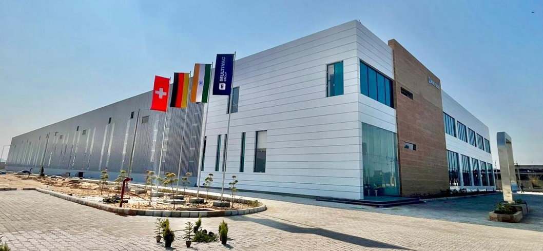 MULTIVAC Factory Exterior with Flags Displayed