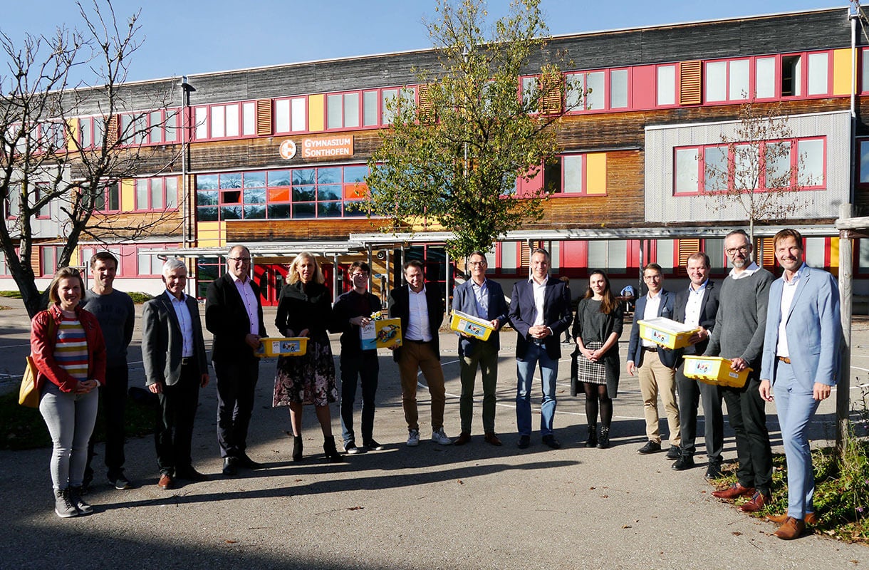 Group Outside School Building with Boxes