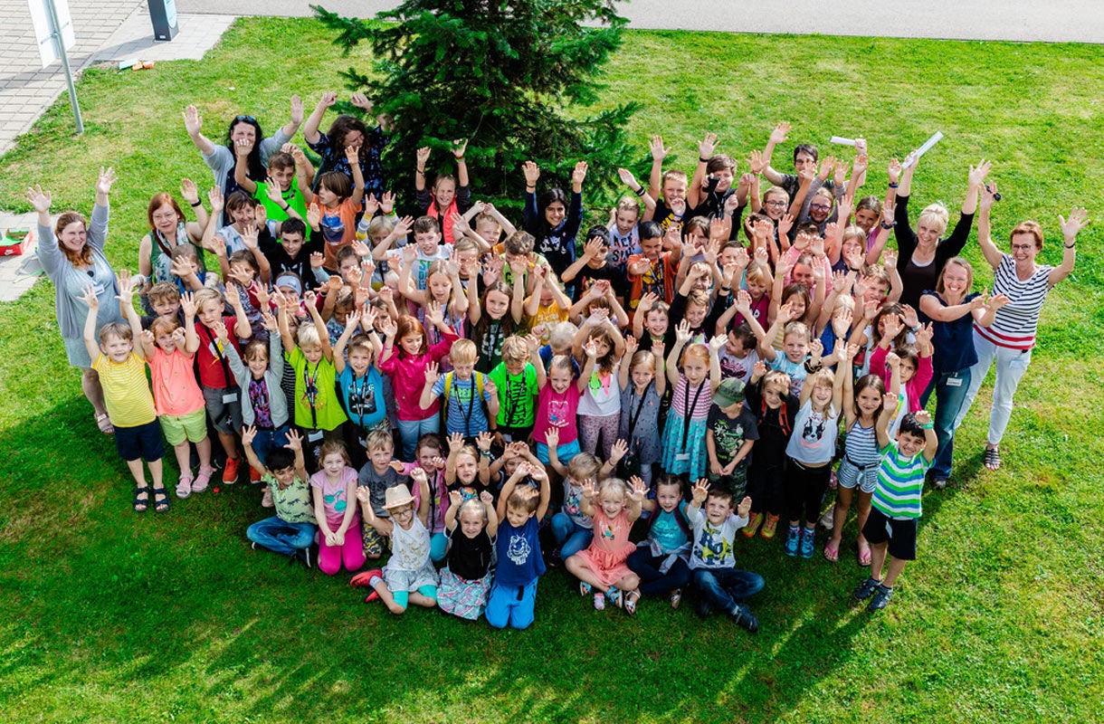 Group of Children Celebrating Outdoors